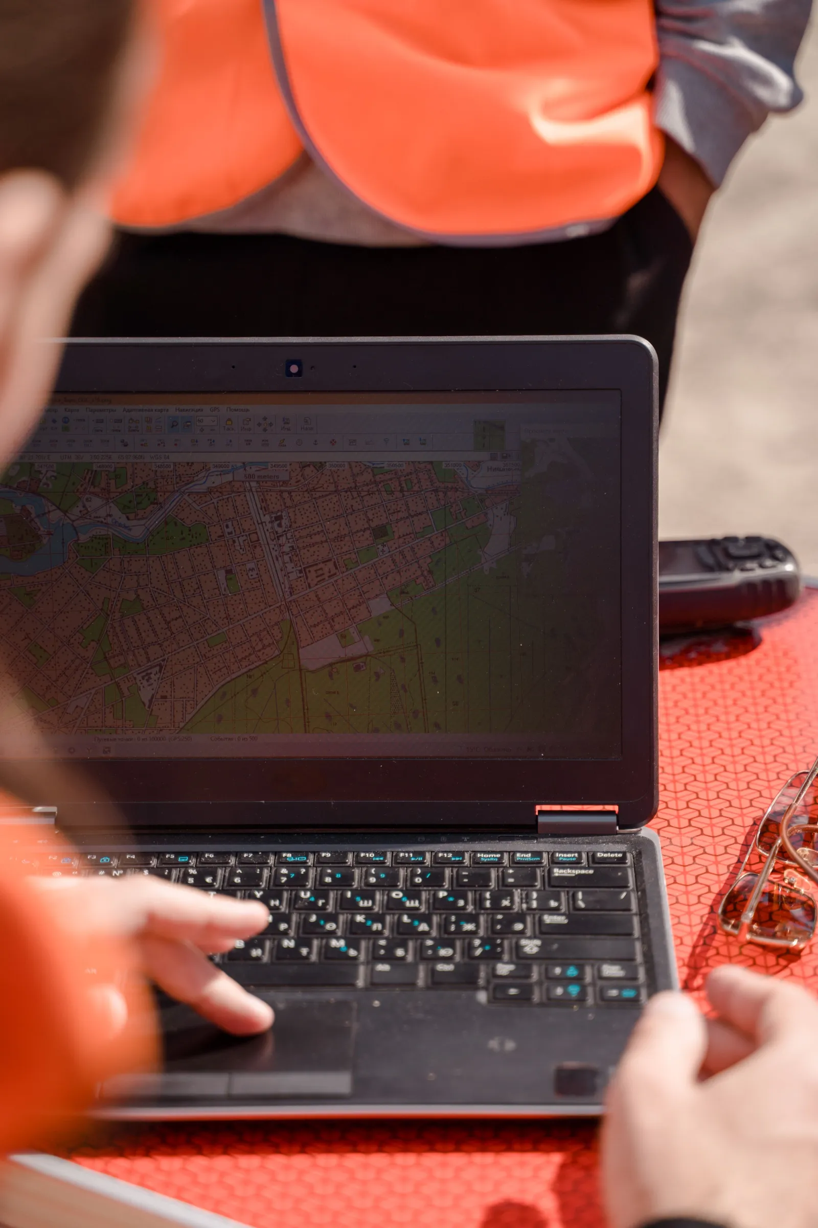 Survey map reviewed on a laptop in the field